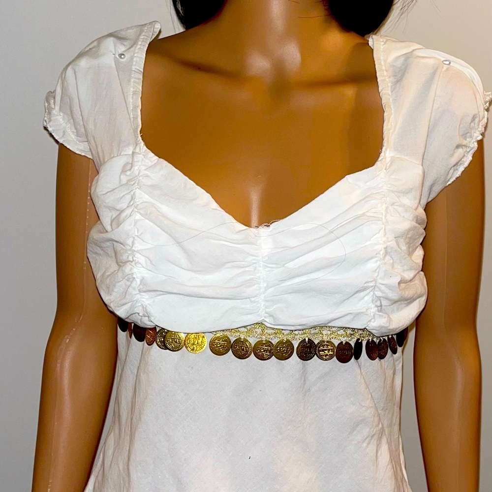 white blouse with gold coin like design.Blouse has a left side zipper.